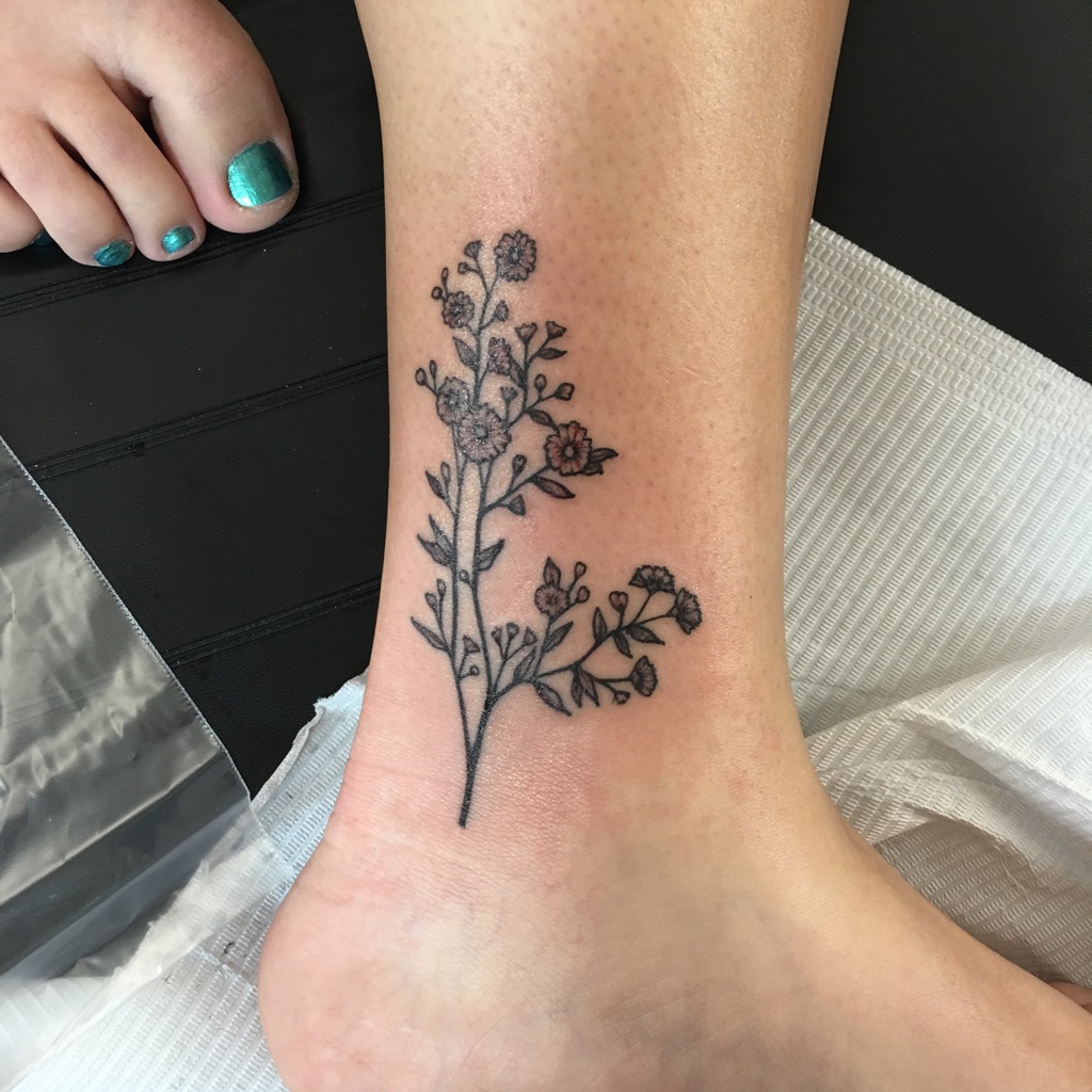 Ashley Primm did this pretty little flower tattoo. Delicate and clean!  405-701-1776 – Studio Ink Gallery